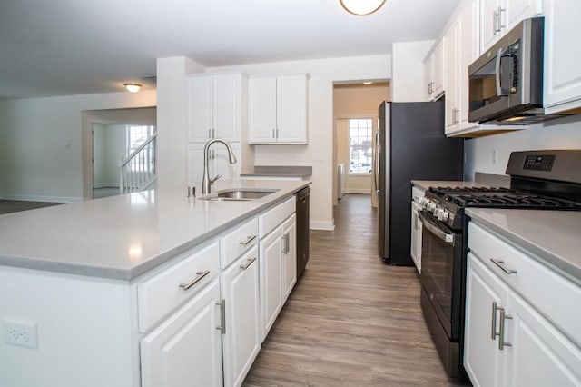 415 Kensington Ct Unit Lt128Adams, Williams Bay, WI 53191 - kitchen featuring stainless steel appliances, white cabinetry, light wood-style flooring, and light countertops