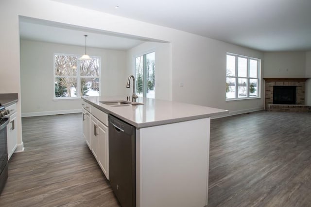 415 Kensington Ct Unit Lt128Adams, Williams Bay, WI 53191 - kitchen featuring dishwasher, a brick fireplace, healthy amount of natural light, and white cabinetry