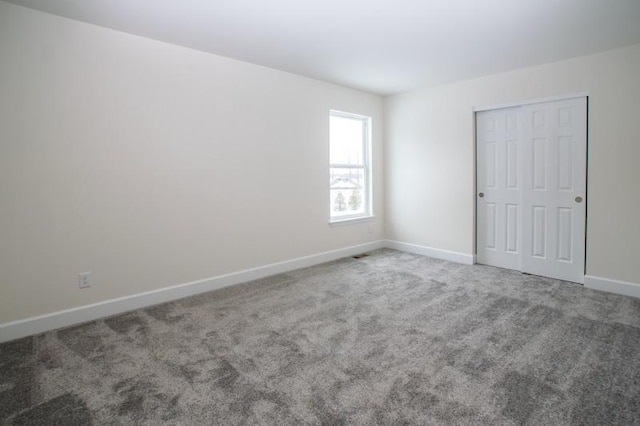 415 Kensington Ct Unit Lt128Adams, Williams Bay, WI 53191 - unfurnished bedroom featuring carpet and a closet