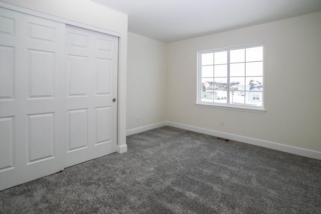 415 Kensington Ct Unit Lt128Adams, Williams Bay, WI 53191 - unfurnished bedroom featuring carpet flooring and a closet