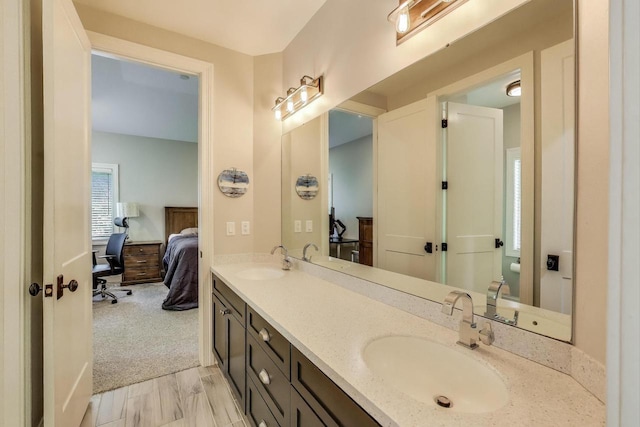 9335 223rd Ave, Salem, WI 53168 - full bathroom featuring ensuite bathroom, double vanity, and wood finished floors