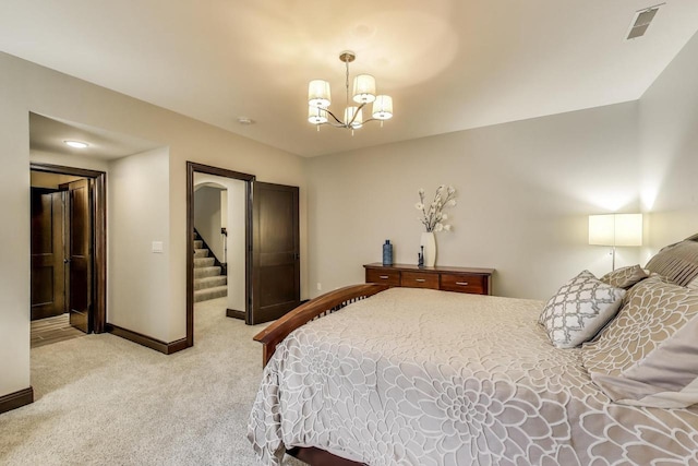 9335 223rd Ave, Salem, WI 53168 - bedroom featuring light carpet and a chandelier