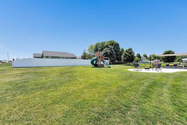582 Clay St, Wrightstown, WI 54180 - view of yard with a playground, a patio area, and an outdoor fire pit