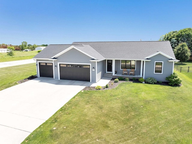 582 Clay St, Wrightstown, WI 54180 - ranch-style home featuring covered porch, driveway, an attached garage, and a shingled roof