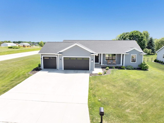 582 Clay St, Wrightstown, WI 54180 - view of front of house featuring a porch, concrete driveway, a garage, and roof with shingles