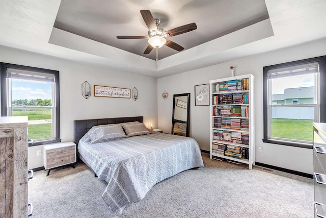 582 Clay St, Wrightstown, WI 54180 - bedroom with a raised ceiling, carpet floors, and a ceiling fan