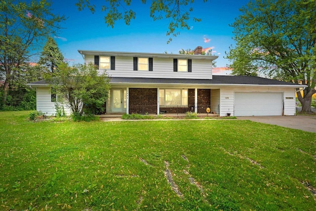 1490 Fernando Dr, Ashwaubenon, WI 54115 - traditional home with a garage, a yard, driveway, a chimney, and a porch