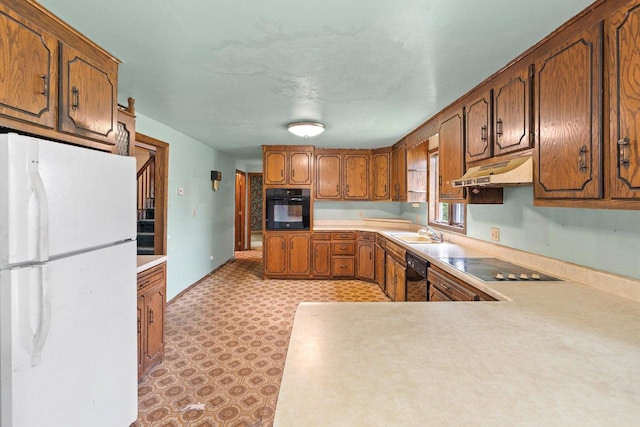 1490 Fernando Dr, Ashwaubenon, WI 54115 - kitchen with black appliances, under cabinet range hood, light countertops, brown cabinets, and light flooring