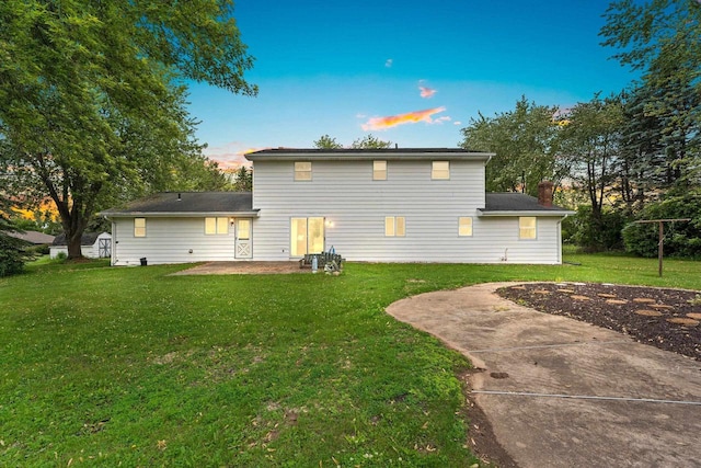 1490 Fernando Dr, Ashwaubenon, WI 54115 - back of house with a yard and a patio area