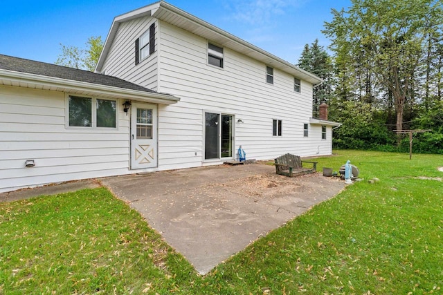 1490 Fernando Dr, Ashwaubenon, WI 54115 - back of house featuring a lawn and a patio