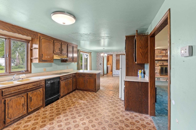 1490 Fernando Dr, Ashwaubenon, WI 54115 - kitchen with black dishwasher, a peninsula, under cabinet range hood, and light countertops
