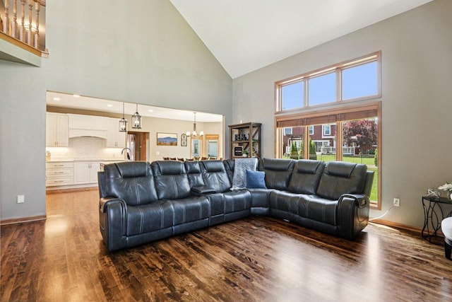 13745 W Park Central Blvd, New Berlin, WI 53151 - living area featuring high vaulted ceiling, dark wood-type flooring, a chandelier, and plenty of natural light