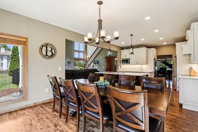 13745 W Park Central Blvd, New Berlin, WI 53151 - dining space featuring a chandelier, healthy amount of natural light, dark wood-style floors, and recessed lighting