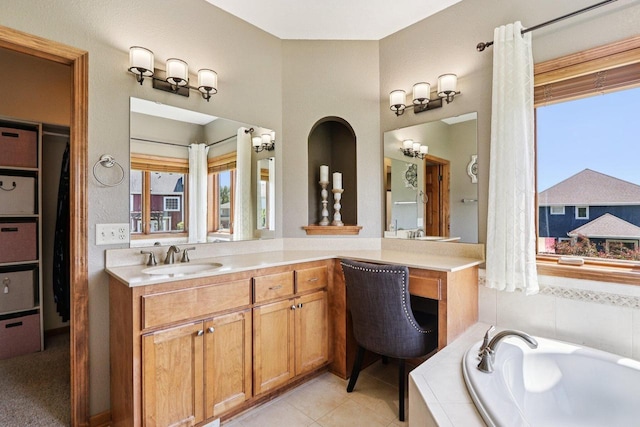 13745 W Park Central Blvd, New Berlin, WI 53151 - bathroom featuring a garden tub, vanity, healthy amount of natural light, and tile patterned floors