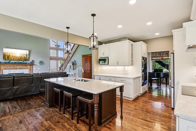 13745 W Park Central Blvd, New Berlin, WI 53151 - kitchen with stainless steel appliances, white cabinetry, dark wood-type flooring, and recessed lighting