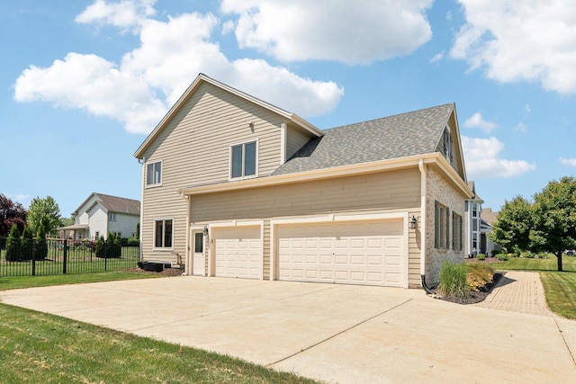 13745 W Park Central Blvd, New Berlin, WI 53151 - view of side of property featuring driveway and a shingled roof
