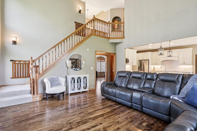 13745 W Park Central Blvd, New Berlin, WI 53151 - living room featuring stairway, dark wood-type flooring, and a high ceiling