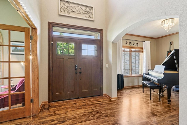 13745 W Park Central Blvd, New Berlin, WI 53151 - foyer featuring arched walkways, wood finished floors, ornamental molding, a chandelier, and a textured wall