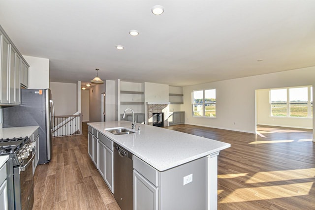 401 Kensington Ct Unit Lt135Lincoln, Williams Bay, WI 53191 - kitchen featuring stainless steel appliances, gray cabinetry, dark wood finished floors, a kitchen island with sink, and recessed lighting