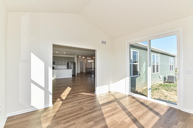 401 Kensington Ct Unit Lt135Lincoln, Williams Bay, WI 53191 - empty room featuring wood finished floors and high vaulted ceiling