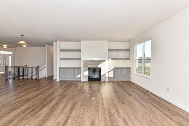401 Kensington Ct Unit Lt135Lincoln, Williams Bay, WI 53191 - unfurnished living room with wood finished floors and a fireplace