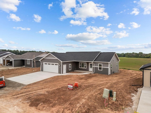 2061 White Dove Ln, Kaukauna, WI 54130 - view of front of home featuring an attached garage and driveway