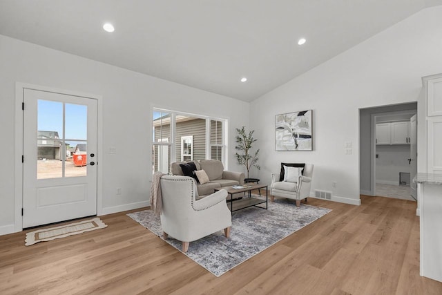 2061 White Dove Ln, Kaukauna, WI 54130 - living room featuring light wood-style flooring, recessed lighting, and high vaulted ceiling
