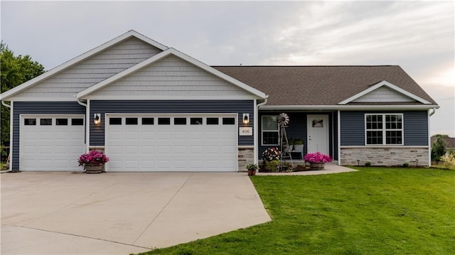 406 S Birch St, Marshfield, WI 54449 - view of front of property featuring an attached garage, a front yard, concrete driveway, and stone siding