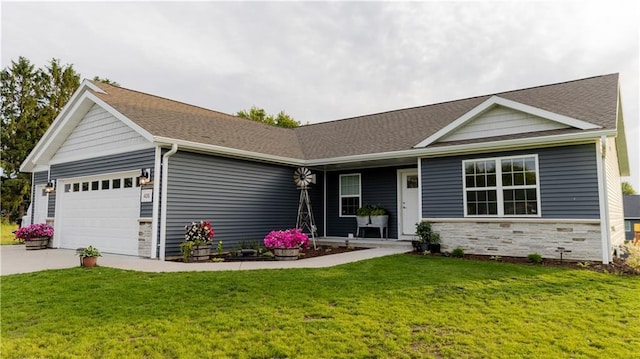 406 S Birch St, Marshfield, WI 54449 - single story home featuring a garage, stone siding, a front lawn, concrete driveway, and a shingled roof