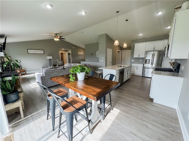 406 S Birch St, Marshfield, WI 54449 - dining room featuring light wood-type flooring, ceiling fan, and vaulted ceiling