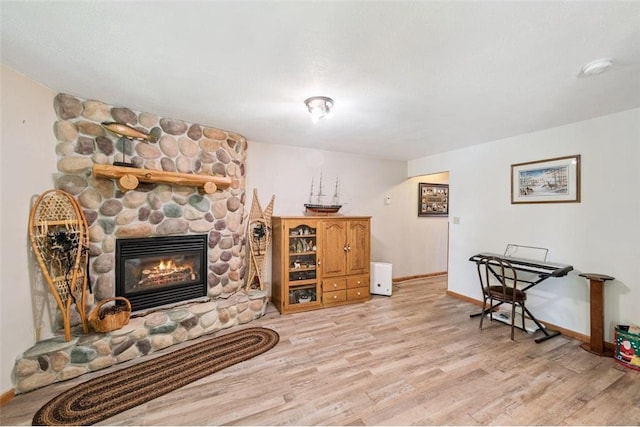 62405 Delta Lake Rd, Iron River, WI 54847 - living room featuring wood finished floors and a fireplace