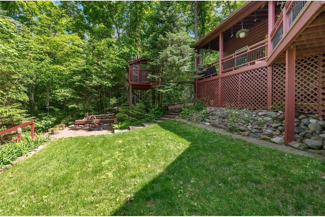 62405 Delta Lake Rd, Iron River, WI 54847 - view of green lawn with a deck