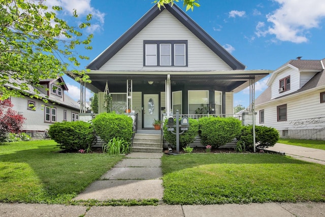552 N 62nd St, Wauwatosa, WI 53213 - bungalow featuring a porch and a front lawn