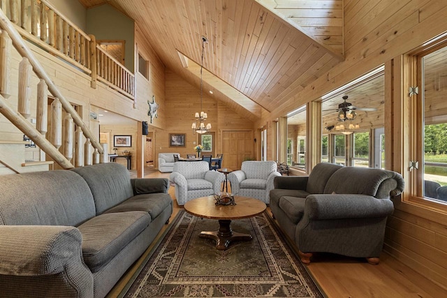 4721 Lake Of The Woods Rd, Sturgeon Bay, WI 54235 - living area with wood walls, high vaulted ceiling, wood ceiling, a chandelier, and wood finished floors