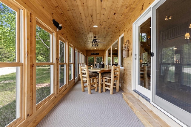 4721 Lake Of The Woods Rd, Sturgeon Bay, WI 54235 - sunroom / solarium featuring carpet flooring, wood walls, and wood ceiling