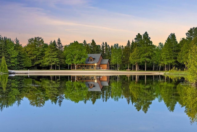 4721 Lake Of The Woods Rd, Sturgeon Bay, WI 54235 - dock featuring a water view and a wooded view
