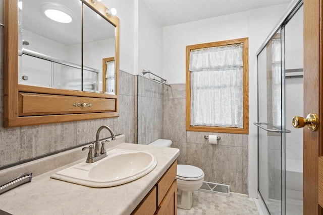 238 N State St, Chilton, WI 53014 - full bath featuring vanity, a stall shower, and tile walls