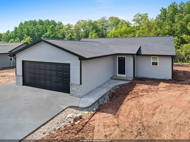 997 E Sunnyview Rd, Oshkosh, WI 54901 - ranch-style home featuring an attached garage, roof with shingles, and driveway