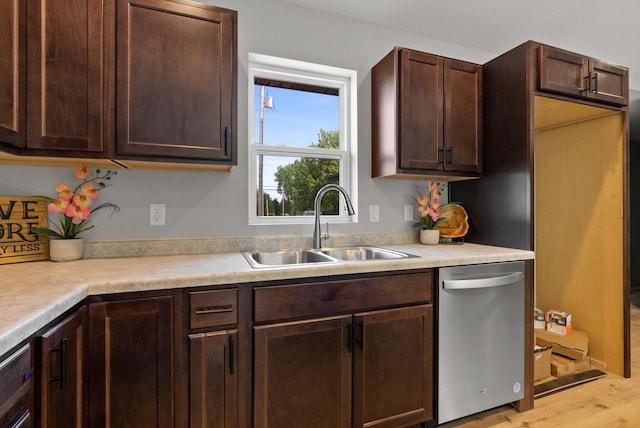 997 E Sunnyview Rd, Oshkosh, WI 54901 - kitchen featuring stainless steel dishwasher, light wood finished floors, light countertops, and dark brown cabinetry