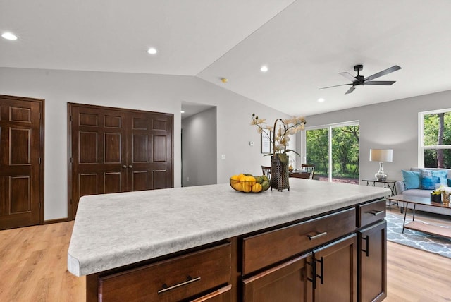 997 E Sunnyview Rd, Oshkosh, WI 54901 - kitchen featuring light wood-type flooring, lofted ceiling, ceiling fan, light countertops, and open floor plan