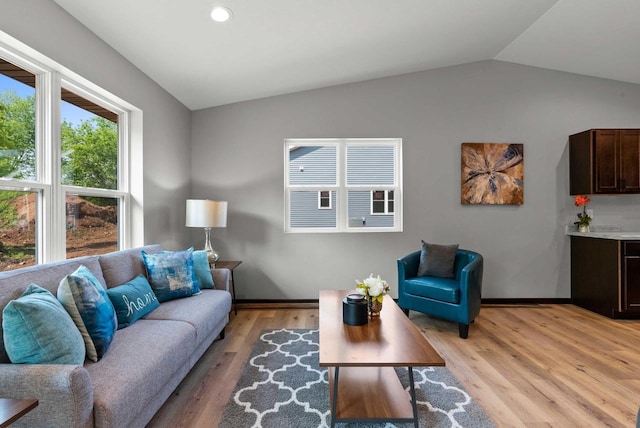 997 E Sunnyview Rd, Oshkosh, WI 54901 - living room with vaulted ceiling, light wood-type flooring, and recessed lighting