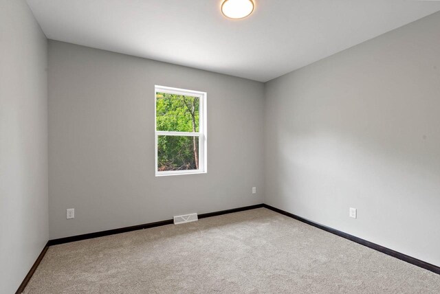 997 E Sunnyview Rd, Oshkosh, WI 54901 - carpeted spare room with baseboards