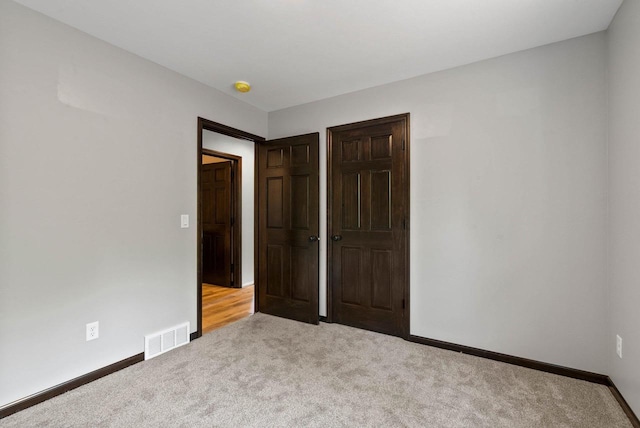997 E Sunnyview Rd, Oshkosh, WI 54901 - unfurnished bedroom featuring carpet floors and baseboards