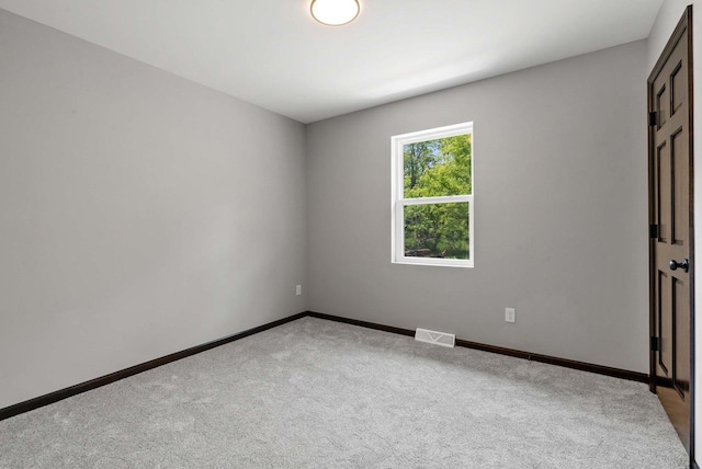 997 E Sunnyview Rd, Oshkosh, WI 54901 - carpeted empty room with baseboards