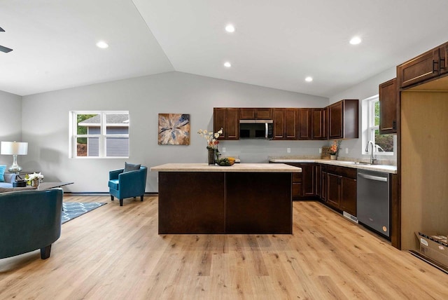 997 E Sunnyview Rd, Oshkosh, WI 54901 - kitchen featuring appliances with stainless steel finishes, lofted ceiling, light wood finished floors, open floor plan, and recessed lighting