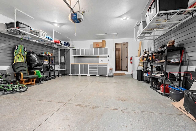 4835 Isabella Cir, Hobart, WI 54155 - garage featuring a garage door opener