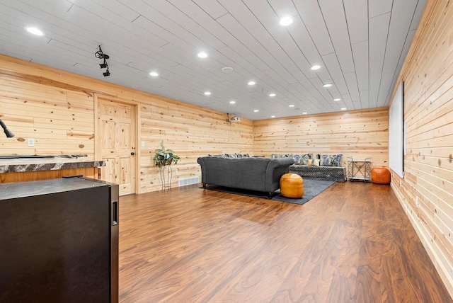 4835 Isabella Cir, Hobart, WI 54155 - living area with wood walls, recessed lighting, and dark wood finished floors