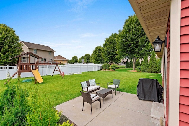 4835 Isabella Cir, Hobart, WI 54155 - fenced backyard featuring a patio, a grill, and a playground