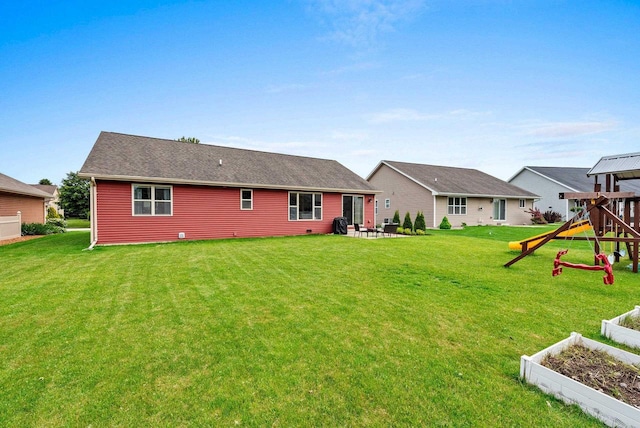 4835 Isabella Cir, Hobart, WI 54155 - back of property featuring a playground, a yard, and a garden