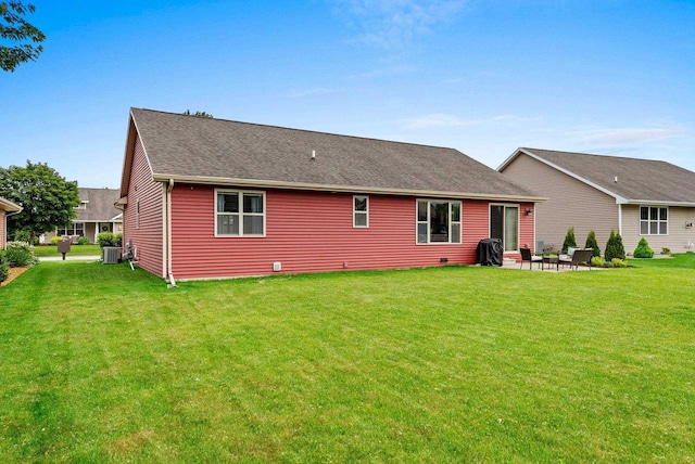 4835 Isabella Cir, Hobart, WI 54155 - rear view of house featuring a patio area, a lawn, and a shingled roof